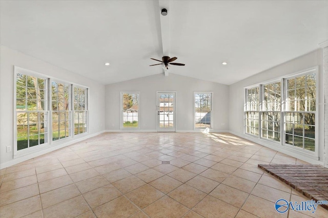 unfurnished living room with a ceiling fan, light tile patterned flooring, vaulted ceiling with beams, and baseboards