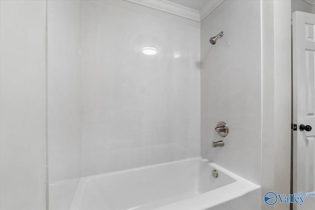 bathroom featuring shower / washtub combination and crown molding