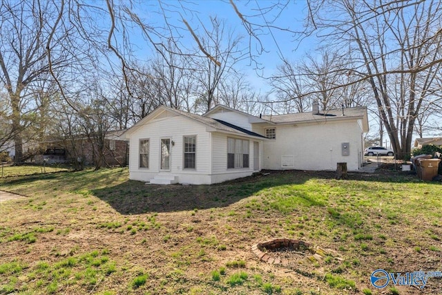 view of property exterior featuring a lawn and a chimney