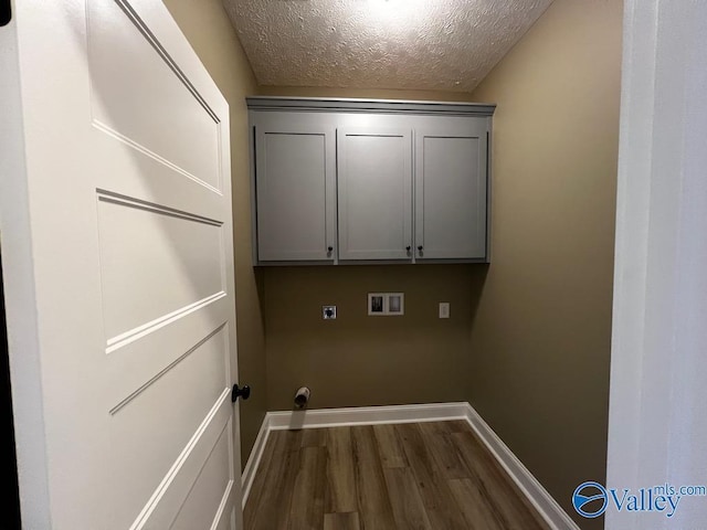 100 James Bowie Dr, Athens, AL 35611 - laundry area with dark wood-style flooring, hookup for a washing machine, a textured ceiling, baseboards, and electric dryer hookup