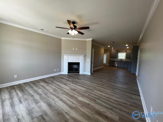 100 James Bowie Dr, Athens, AL 35611 - unfurnished living room with a ceiling fan, ornamental molding, baseboards, dark wood-type flooring, and recessed lighting