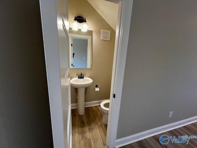100 James Bowie Dr, Athens, AL 35611 - half bath with wood finished floors, toilet, and baseboards