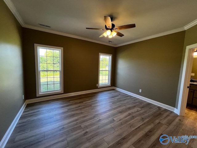 100 James Bowie Dr, Athens, AL 35611 - spare room with dark wood-style floors, ornamental molding, ceiling fan, and baseboards