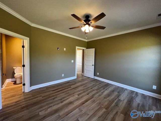 100 James Bowie Dr, Athens, AL 35611 - unfurnished bedroom featuring crown molding, dark wood-style flooring, baseboards, connected bathroom, and a ceiling fan