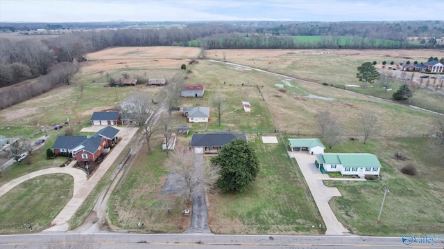 birds eye view of property with a rural view