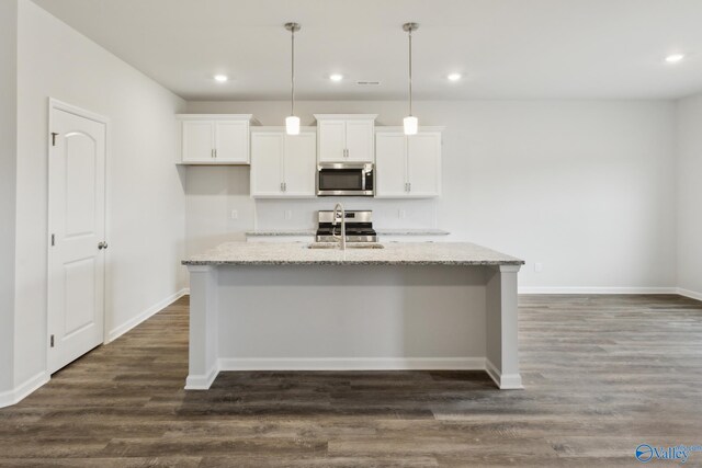 living room with sink and light hardwood / wood-style floors