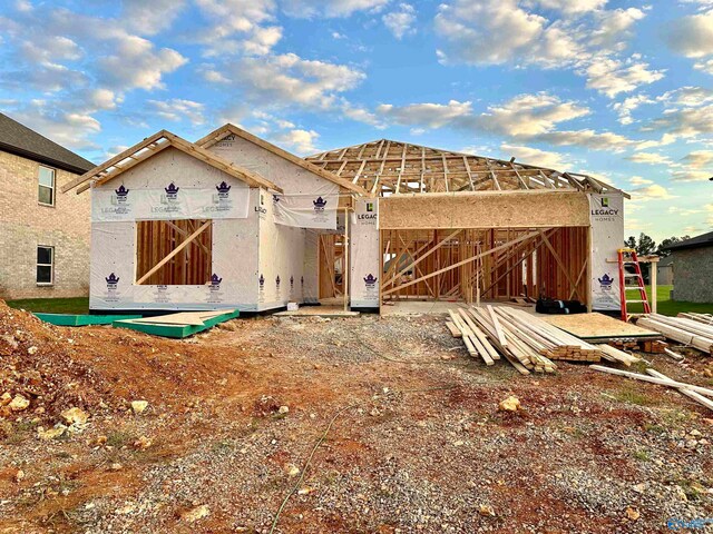 rear view of property with an outbuilding