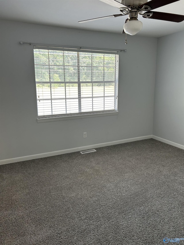 unfurnished room with carpet and ceiling fan