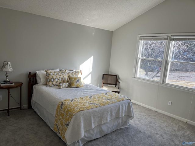 carpeted bedroom with lofted ceiling and a textured ceiling