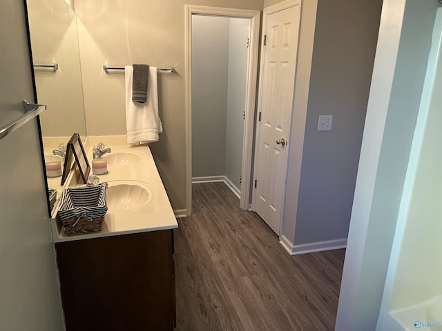 bathroom featuring hardwood / wood-style flooring and vanity