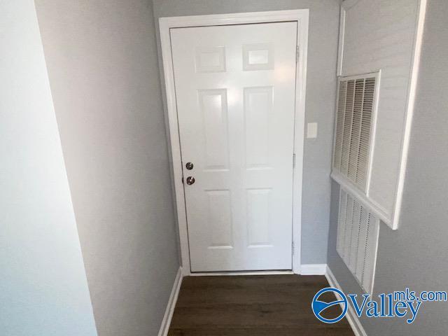2940 Hood Rd SW Unit I, Huntsville, AL 35805 - entryway with a heating unit, baseboards, and dark wood finished floors