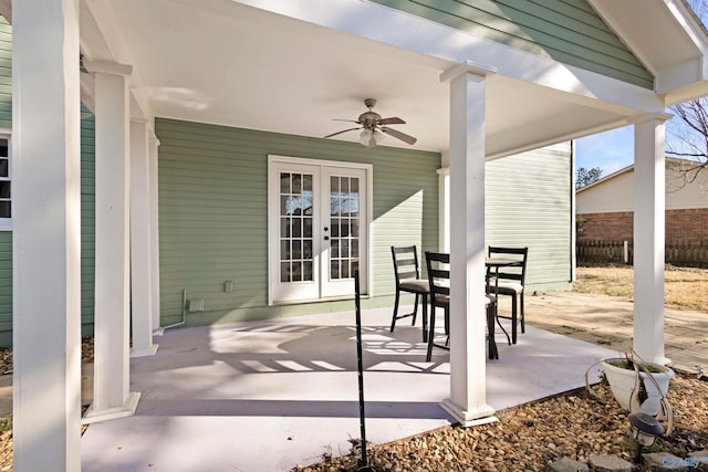 view of patio / terrace featuring ceiling fan and french doors