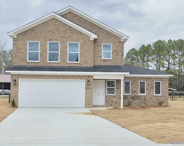 view of front facade featuring brick siding, an attached garage, and driveway