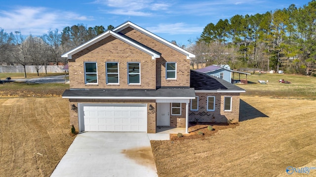 traditional-style house featuring brick siding, driveway, an attached garage, and a front yard