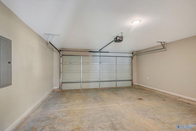 garage with baseboards and a garage door opener