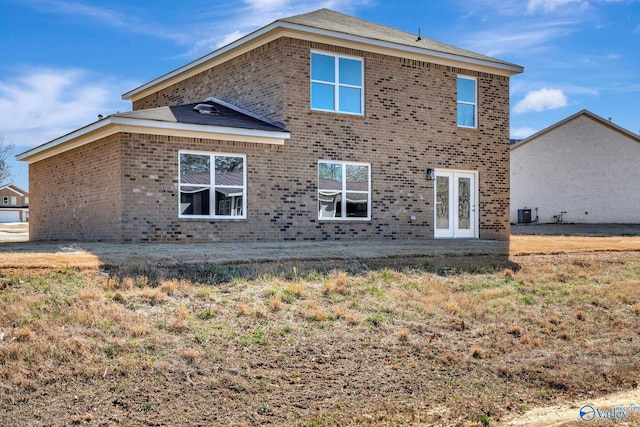 back of house with brick siding