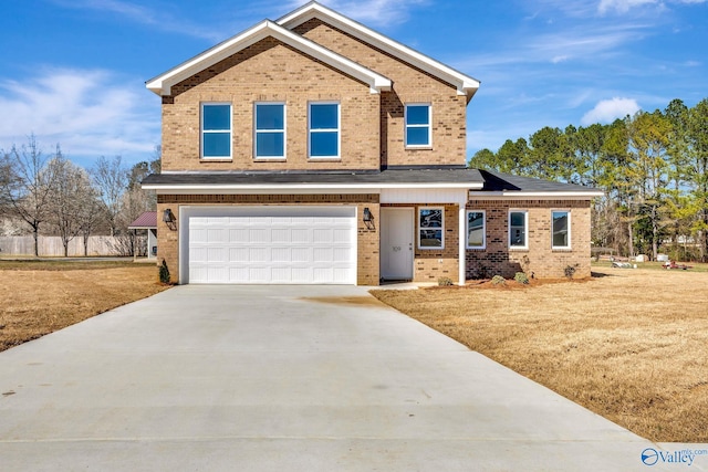 view of front of property with brick siding, concrete driveway, a garage, and a front yard