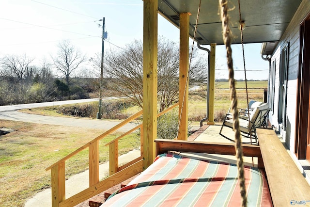 sunroom / solarium with a rural view