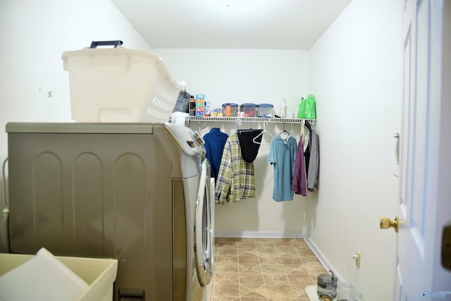 laundry room with sink and washing machine and clothes dryer