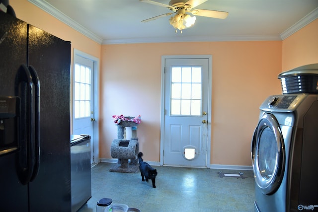 laundry area featuring ceiling fan, washer / clothes dryer, and ornamental molding