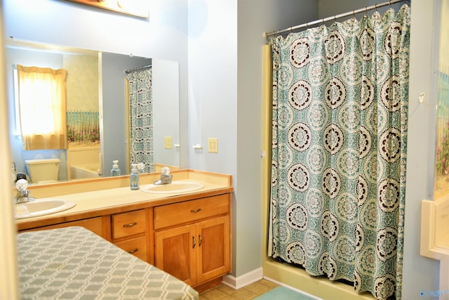 bathroom with walk in shower, vanity, and tile patterned floors