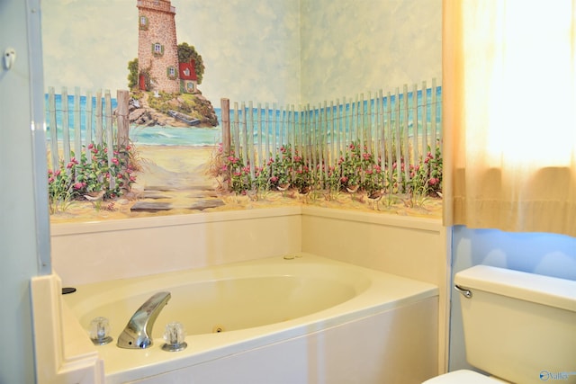 bathroom featuring a tub to relax in and toilet