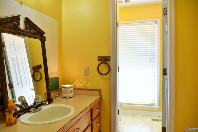 bathroom with tile patterned flooring and vanity