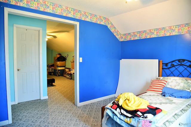 carpeted bedroom with lofted ceiling