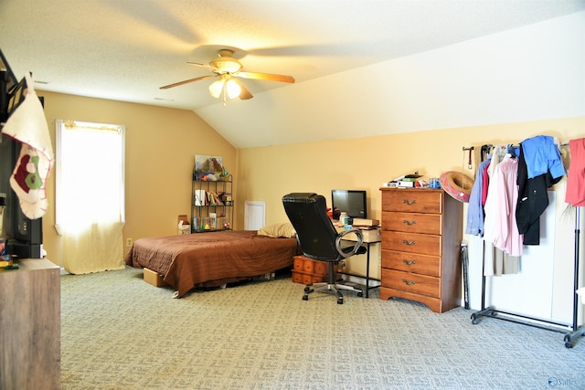 carpeted bedroom with ceiling fan, access to outside, and vaulted ceiling