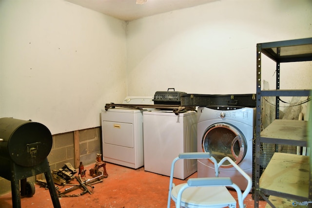 clothes washing area featuring washer and dryer