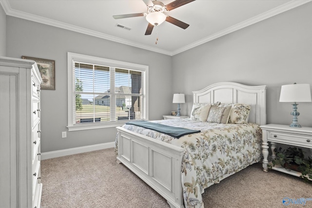 carpeted bedroom featuring ornamental molding and ceiling fan