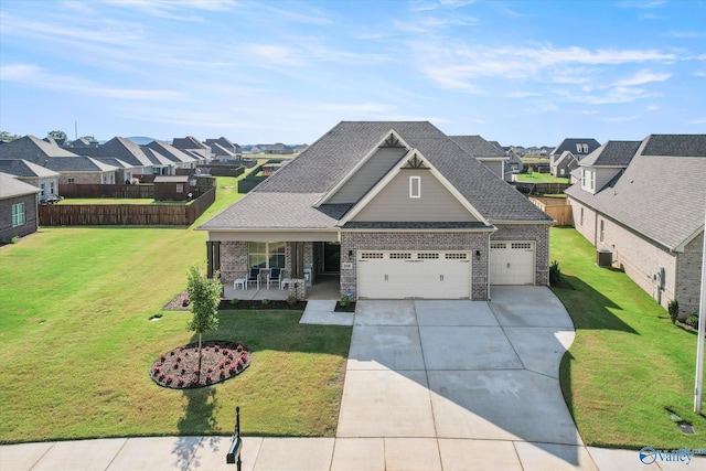 craftsman-style house featuring cooling unit, a porch, and a front yard