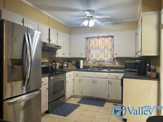 kitchen featuring appliances with stainless steel finishes, crown molding, white cabinetry, and sink