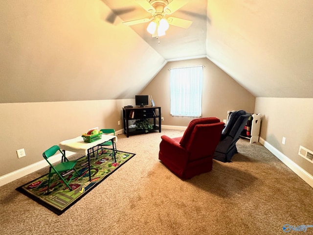 interior space with lofted ceiling, carpet floors, and ceiling fan