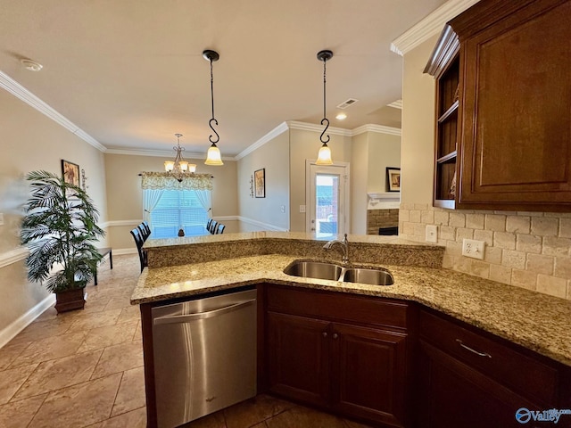 kitchen featuring pendant lighting, sink, dishwasher, light stone counters, and kitchen peninsula