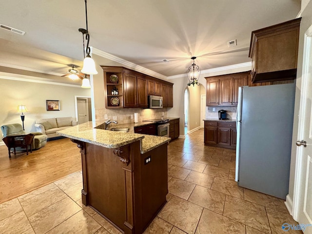 kitchen featuring decorative light fixtures, stainless steel appliances, kitchen peninsula, and a breakfast bar