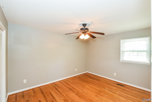 unfurnished room with ceiling fan and light hardwood / wood-style flooring