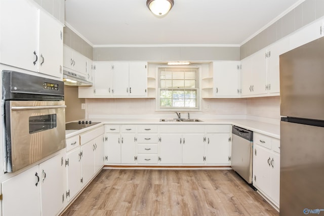 kitchen featuring appliances with stainless steel finishes, white cabinets, crown molding, light hardwood / wood-style flooring, and sink