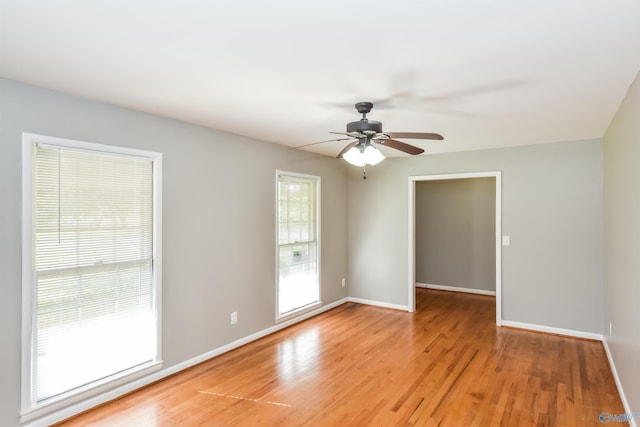 spare room featuring ceiling fan and light hardwood / wood-style flooring