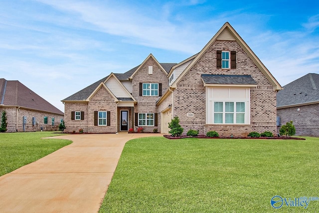 view of front of house with a garage and a front lawn