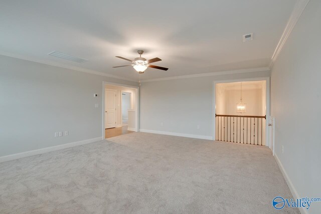 spare room with light carpet, ceiling fan with notable chandelier, and ornamental molding