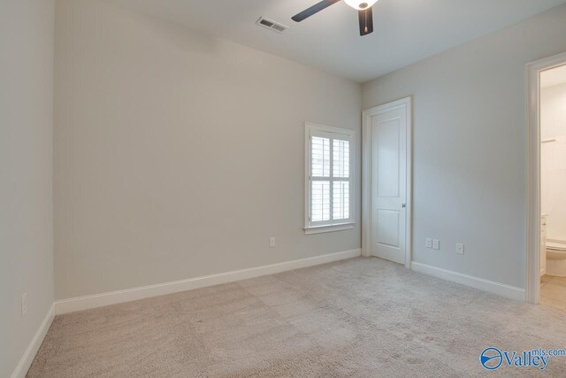 carpeted empty room featuring ceiling fan