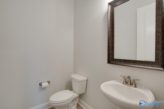 bathroom with toilet and sink