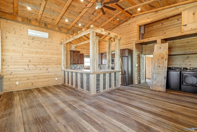 kitchen featuring appliances with stainless steel finishes, wood ceiling, wooden walls, vaulted ceiling with beams, and dark hardwood / wood-style floors