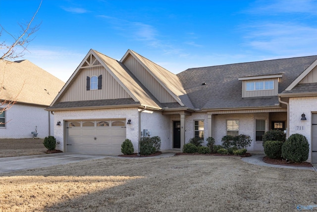 view of front of home with a garage and a front lawn