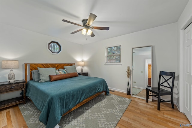 bedroom featuring hardwood / wood-style flooring and ceiling fan