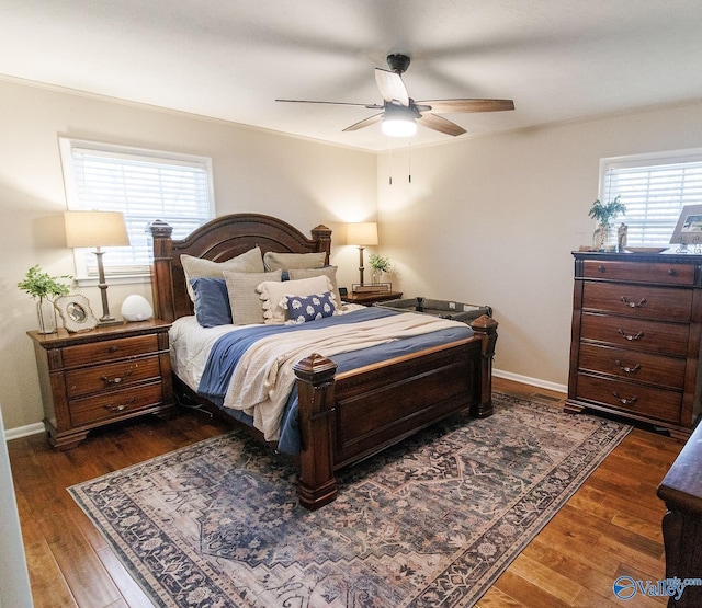 bedroom featuring dark wood-type flooring and ceiling fan