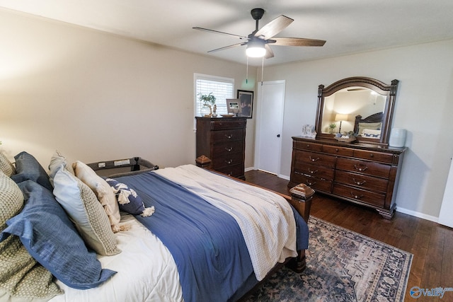 bedroom with ceiling fan and dark hardwood / wood-style flooring