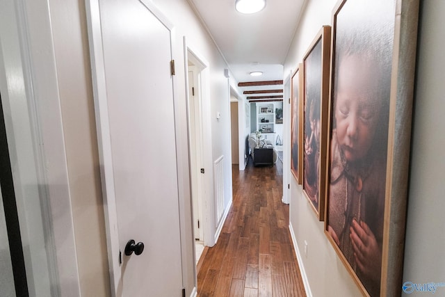 hallway with dark hardwood / wood-style flooring