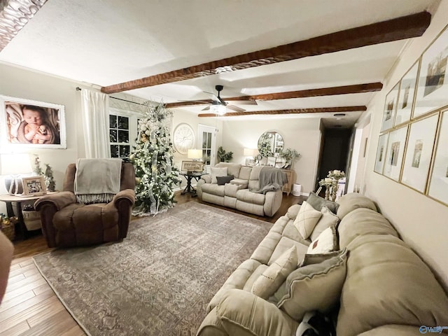 living room with wood-type flooring, ceiling fan, and beam ceiling